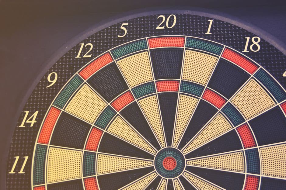 A close-up of a dartboard showing the numbered scoring segments